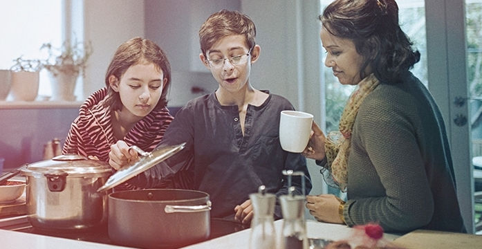 A mother and her children cooking together